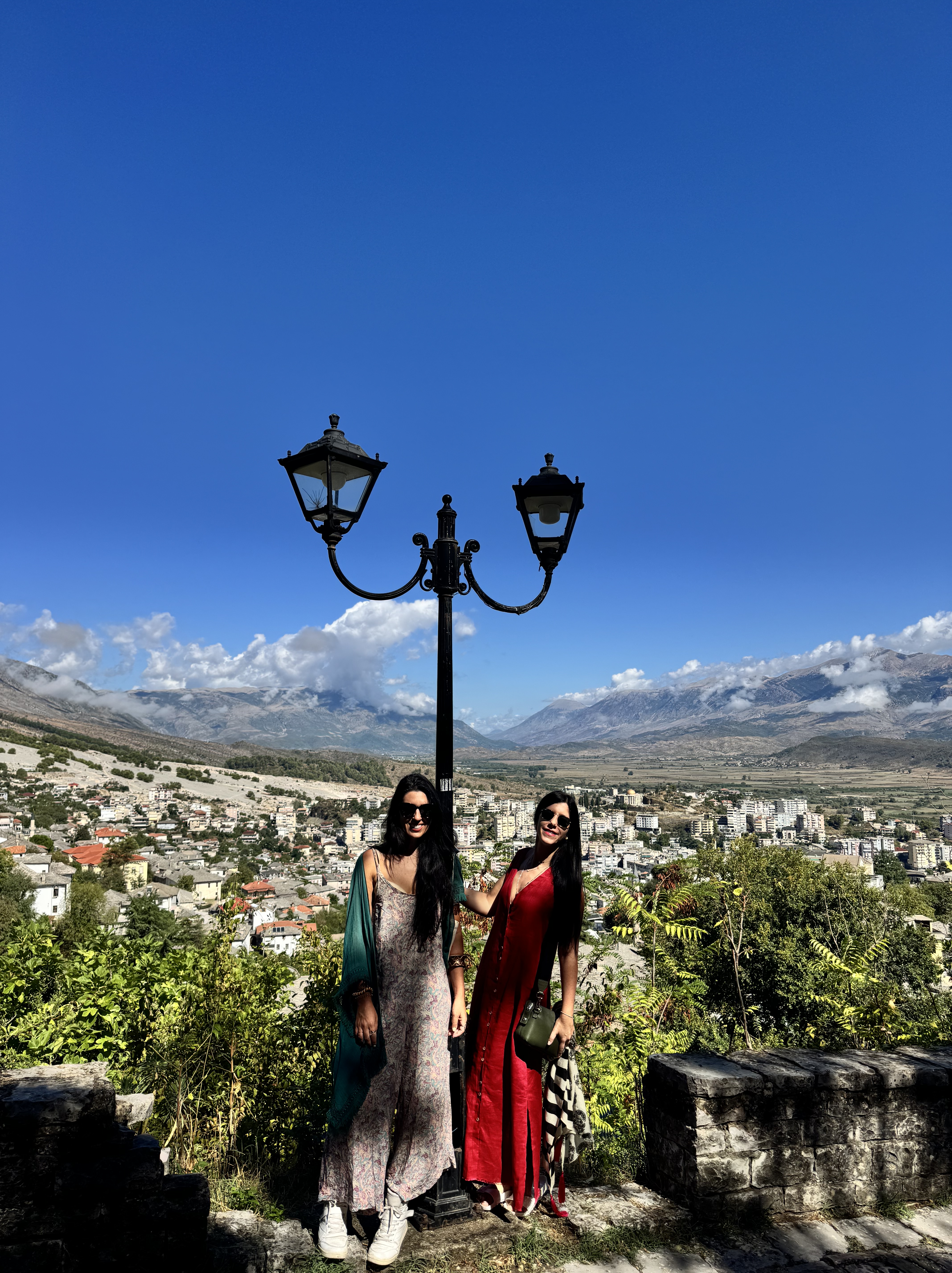 A map of the world with a coffee cup spilling over it. The cup is overflowing, and the coffee is flowing down and left ont...